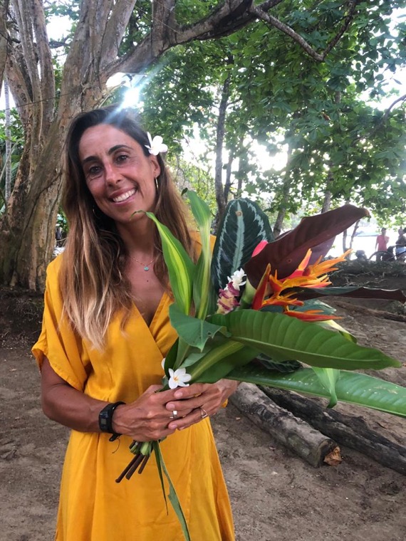 Portrait of Anne-Cécile with a tropical bouquet.