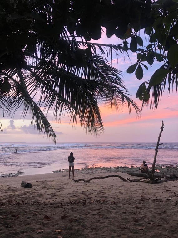 Silhouette on the beach at sunset.