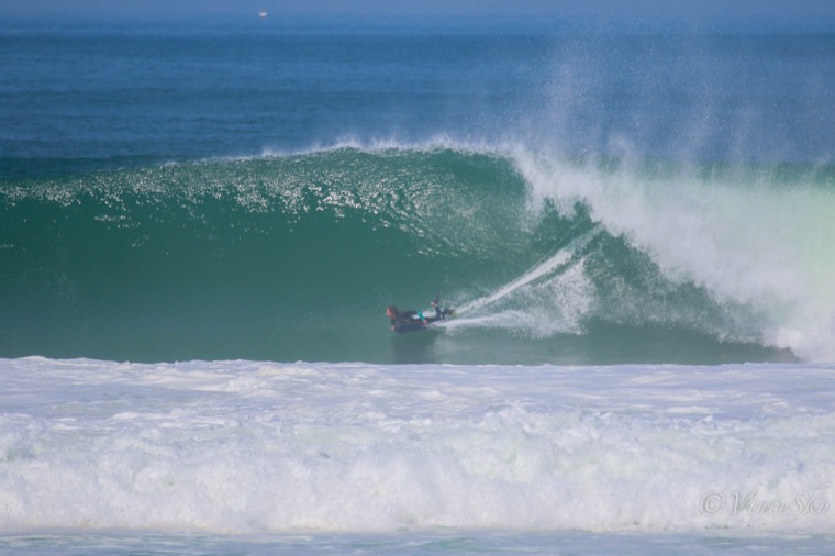 Anne-Cécile under a hollow wave.