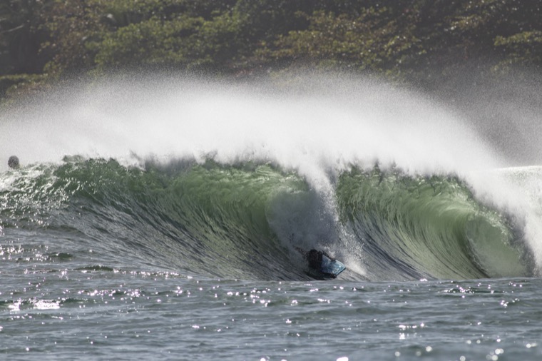 Anne-Cécile under the lip of a green wave.